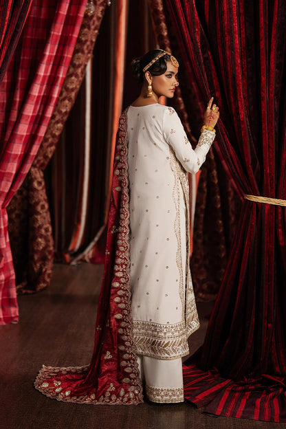 Elegant ivory raw silk suit featuring embroidered front and back panels, digital printed silk dupatta, and matching trousers—perfect for festive and formal occasions.
