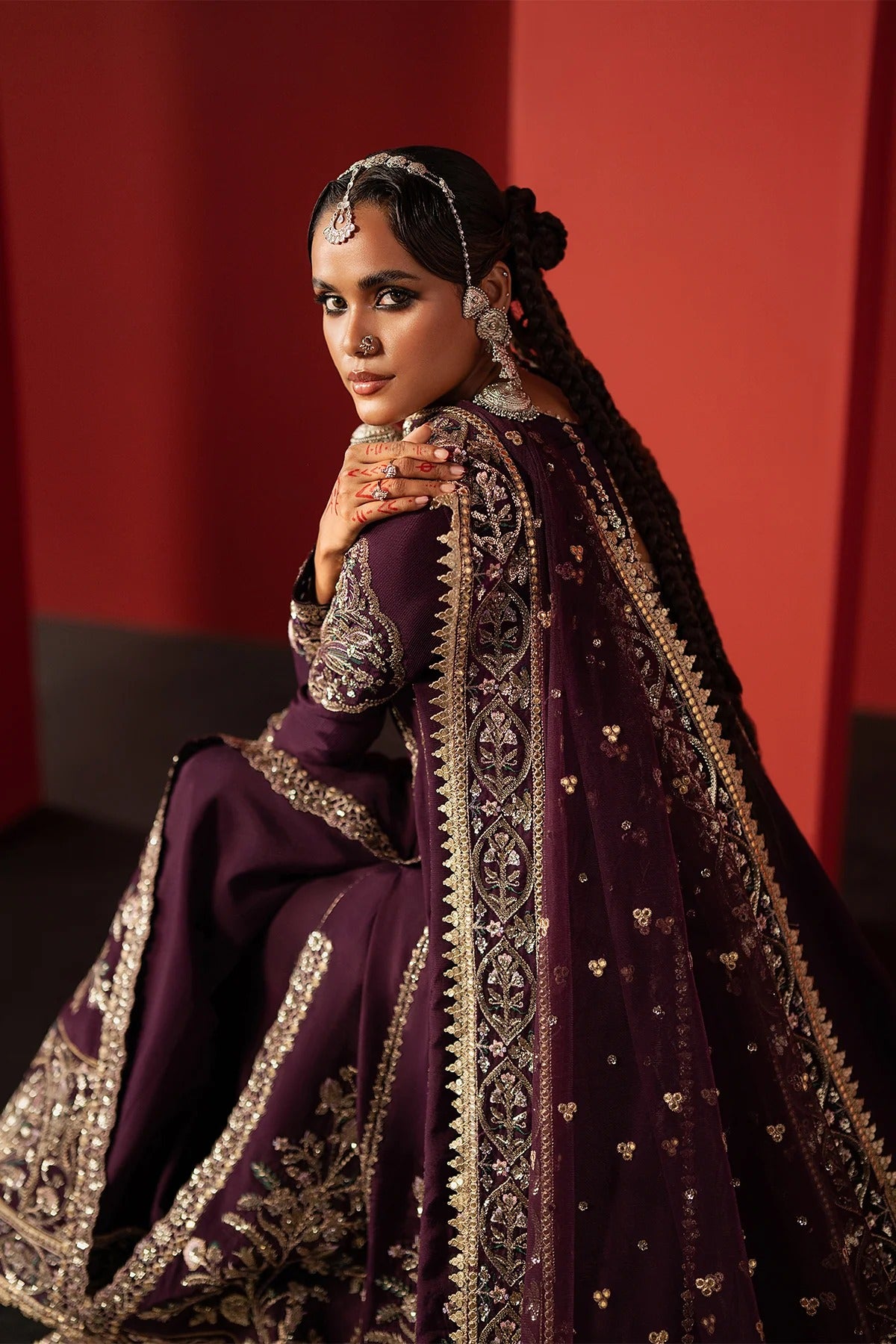 Experience elegance with this purple raw silk embroidered suit featuring premium panels, organza borders, and a net dupatta—perfect for festive and formal wear.