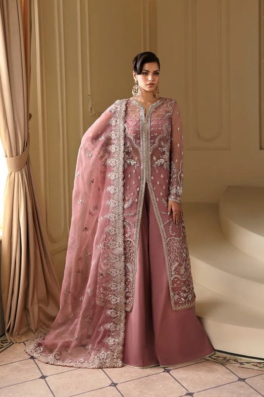 Elegant organza dress featuring hand-embellished panels, sleeves, chok patti, borders, and dupatta. Includes Russian grip inner and raw silk trouser fabric.