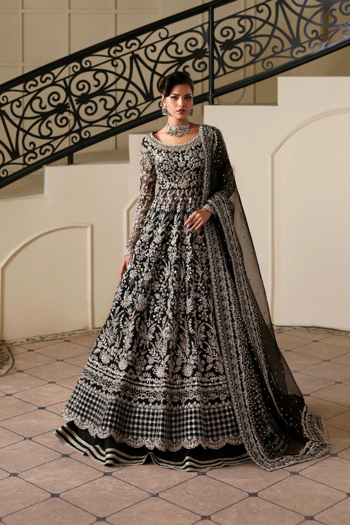 Stunning hand-embellished organza outfit with detailed panels, matching dupatta, Russian grip inner, and raw silk lehenga fabric. Ideal for formal occasions.