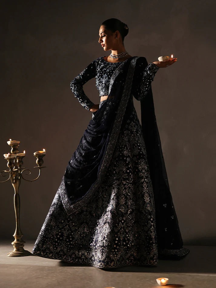 Stunning velvet embroidered 3PC lehenga set with sequined bodice, raw silk panels & chiffon dupatta. Perfect for weddings, parties & festive occasions.