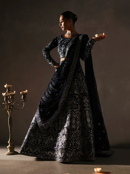 Stunning velvet embroidered 3PC lehenga set with sequined bodice, raw silk panels & chiffon dupatta. Perfect for weddings, parties & festive occasions.