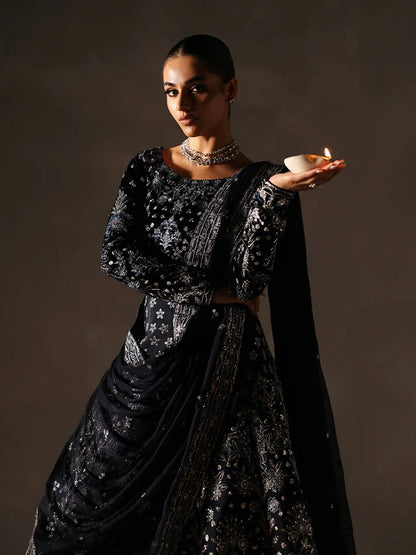 Stunning velvet embroidered 3PC lehenga set with sequined bodice, raw silk panels & chiffon dupatta. Perfect for weddings, parties & festive occasions.