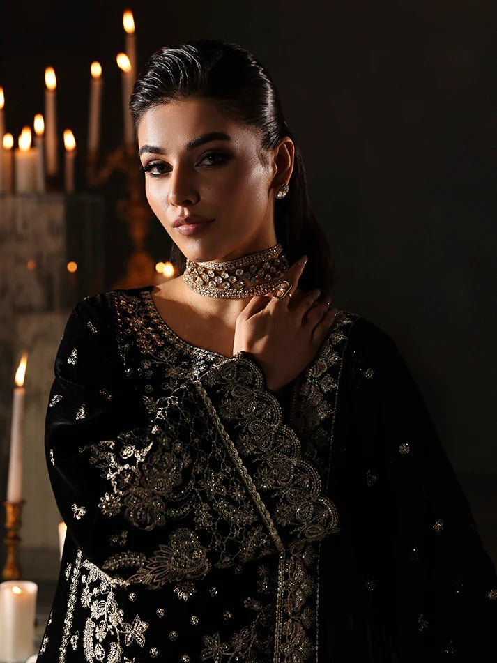 Luxurious velvet embroidered 3PC suit with sequins, chiffon dupatta & raw silk trouser. Perfect for festive events, weddings & all-season premium style.