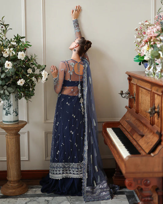 Hand-embroidered net shirt with sequins & pearls, paired with dyed silk lehenga. Perfect for weddings, festive & special occasions.