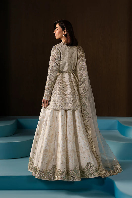 Graceful ivory wedding formal crafted in raw silk with hand-embellished embroidery, organza dupatta, lehnga borders and a timeless silhouette.
