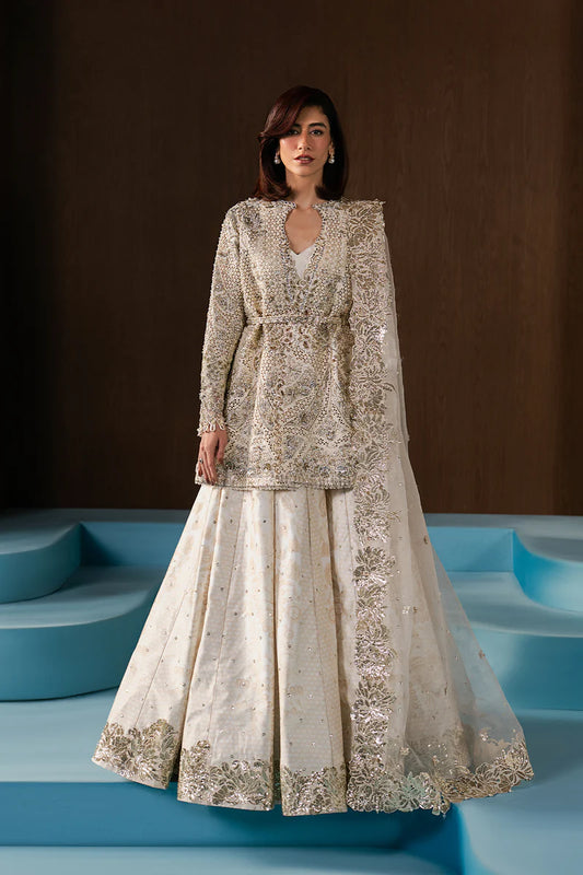 Graceful ivory wedding formal crafted in raw silk with hand-embellished embroidery, organza dupatta, lehnga borders and a timeless silhouette.
