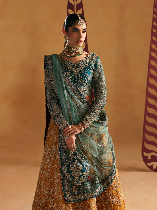 Luxury lehenga set featuring embroidered net bodice, sequined sleeves, organza panels, raw silk borders, detailed adda work, and matching embellished dupatta.