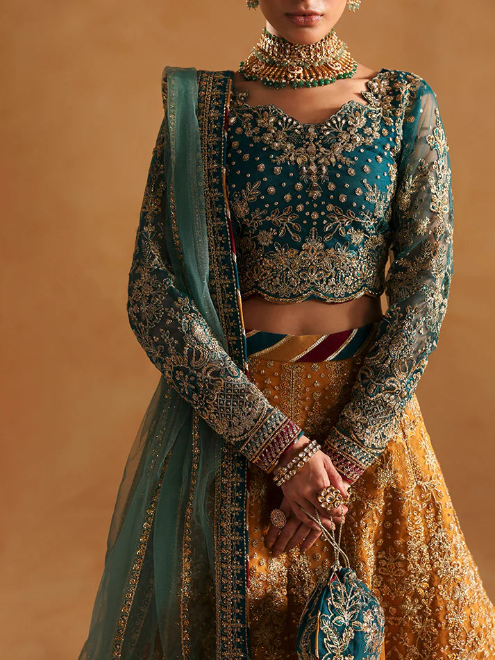 Luxury lehenga set featuring embroidered net bodice, sequined sleeves, organza panels, raw silk borders, detailed adda work, and matching embellished dupatta.