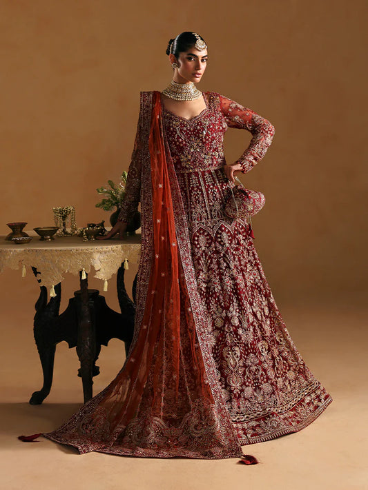 Elegant kalidaar pishwas featuring adda-worked net bodice, sequined panels, embroidered sleeves, raw silk lehnga, and dupatta ensemble.