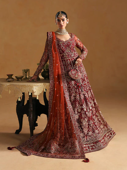 Elegant kalidaar pishwas featuring adda-worked net bodice, sequined panels, embroidered sleeves, raw silk lehnga, and dupatta ensemble.