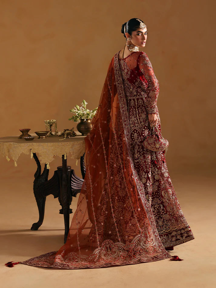Elegant kalidaar pishwas featuring adda-worked net bodice, sequined panels, embroidered sleeves, raw silk lehnga, and dupatta ensemble.