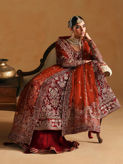 Elegant kalidaar pishwas featuring adda-worked net bodice, sequined panels, embroidered sleeves, raw silk lehnga, and dupatta ensemble.