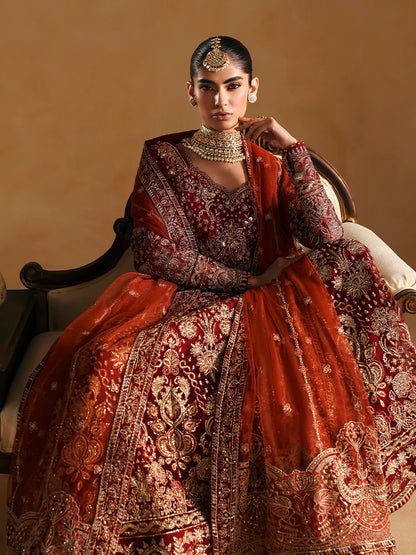 Elegant kalidaar pishwas featuring adda-worked net bodice, sequined panels, embroidered sleeves, raw silk lehnga, and dupatta ensemble.