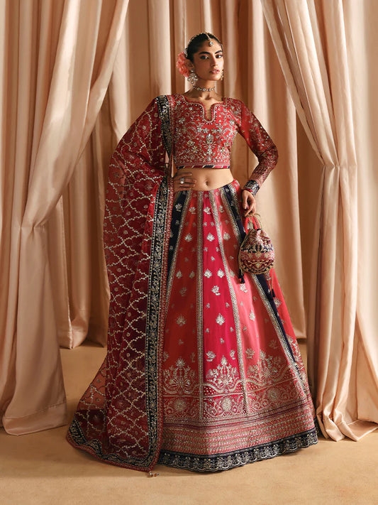 Luxury silk lehenga set with adda-worked bodice, sequined panels, detailed borders, embroidered sleeves, and a fully embellished organza dupatta ensemble.