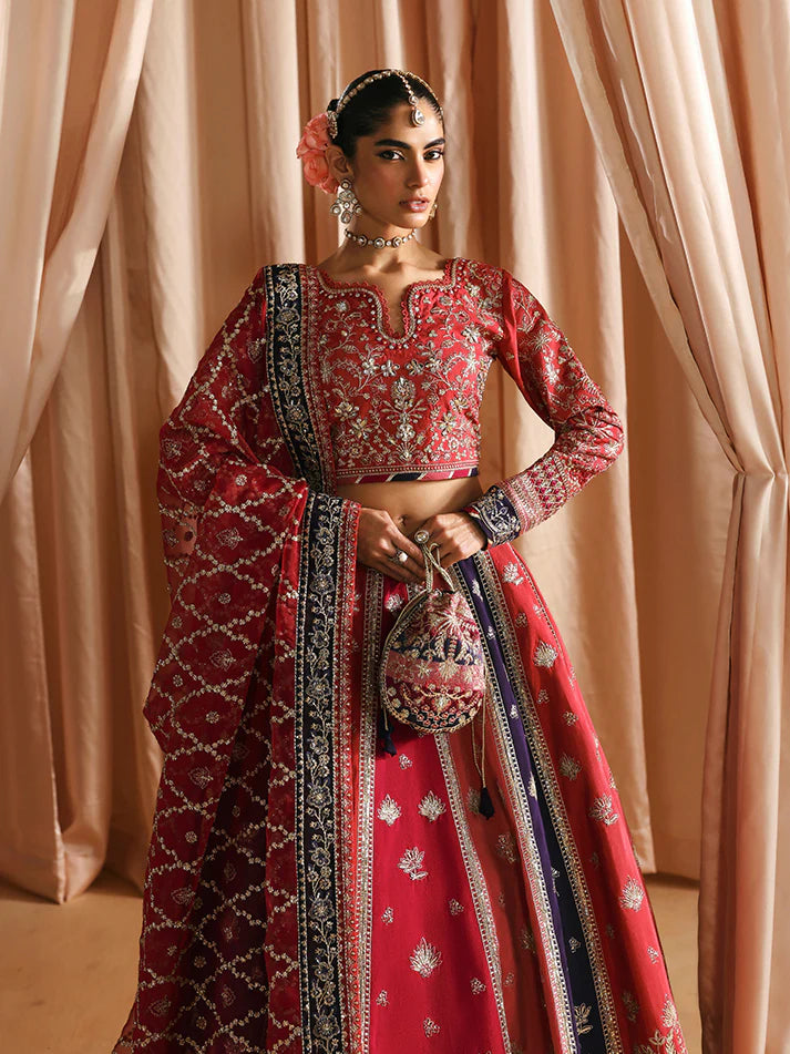 Luxury silk lehenga set with adda-worked bodice, sequined panels, detailed borders, embroidered sleeves, and a fully embellished organza dupatta ensemble.