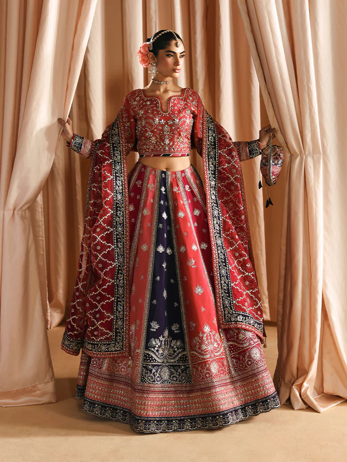 Luxury silk lehenga set with adda-worked bodice, sequined panels, detailed borders, embroidered sleeves, and a fully embellished organza dupatta ensemble.