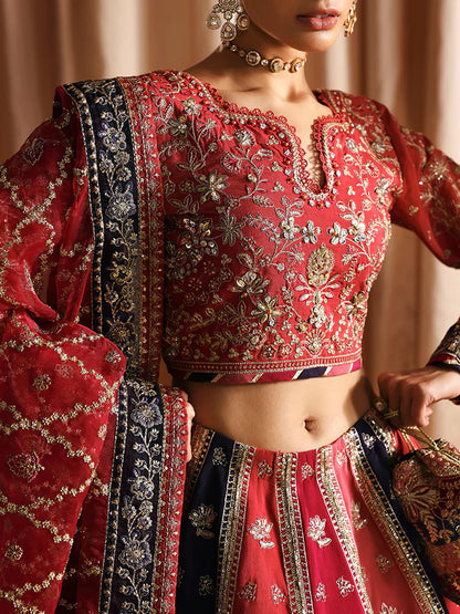 Luxury silk lehenga set with adda-worked bodice, sequined panels, detailed borders, embroidered sleeves, and a fully embellished organza dupatta ensemble.
