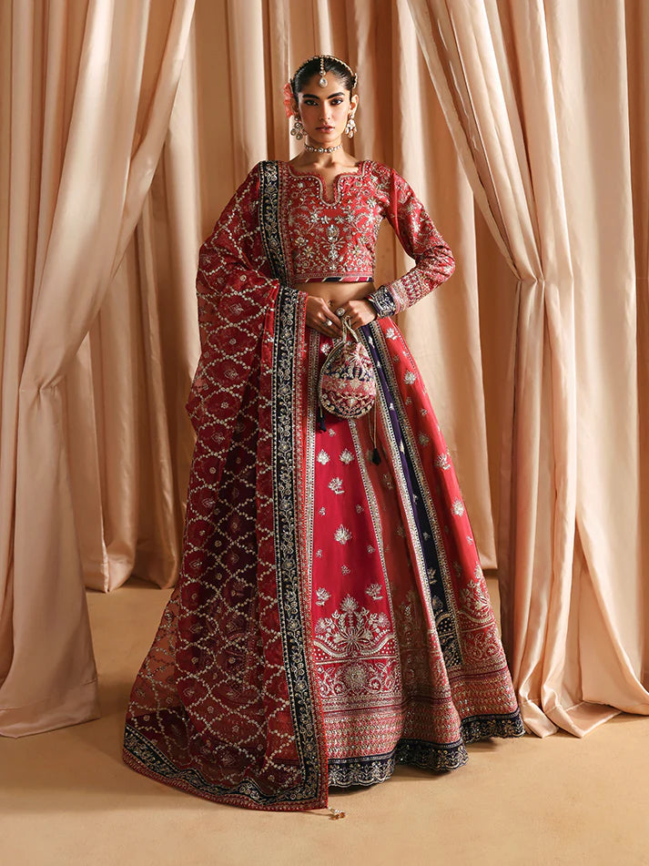 Luxury silk lehenga set with adda-worked bodice, sequined panels, detailed borders, embroidered sleeves, and a fully embellished organza dupatta ensemble.