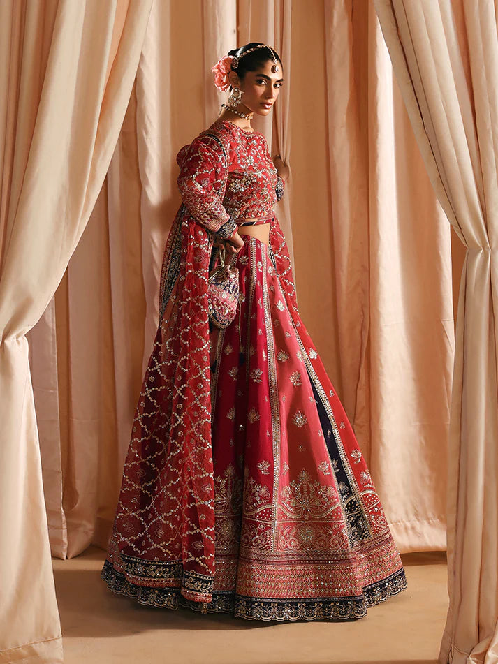 Luxury silk lehenga set with adda-worked bodice, sequined panels, detailed borders, embroidered sleeves, and a fully embellished organza dupatta ensemble.