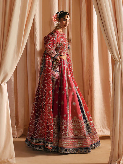 Luxury silk lehenga set with adda-worked bodice, sequined panels, detailed borders, embroidered sleeves, and a fully embellished organza dupatta ensemble.