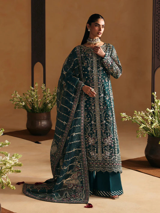 Elegant organza shirt set featuring sequined panels, embroidered borders and sleeves, linear dupatta with motifs, and a rich raw silk sharara ensemble.