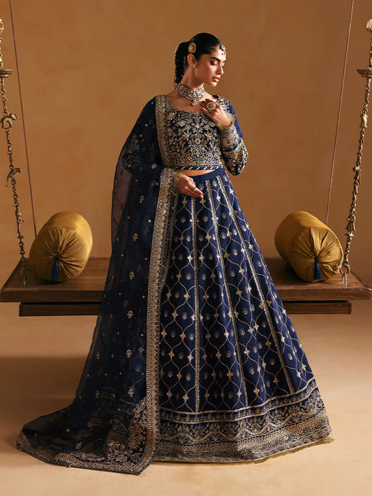 Luxury silk lehenga set with adda-worked bodice, sequined panels, detailed borders, embroidered sleeves, and an elegant organza dupatta ensemble for weddings.