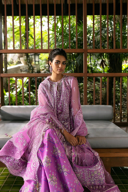 Stunning lilac 3-piece unstitched set in net & organza with hand and machine embroidery, including printed lehnga and dupatta, ideal for weddings and festive occasions.
