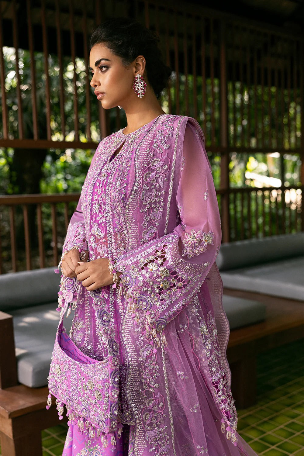 Stunning lilac 3-piece unstitched set in net & organza with hand and machine embroidery, including printed lehnga and dupatta, ideal for weddings and festive occasions.

