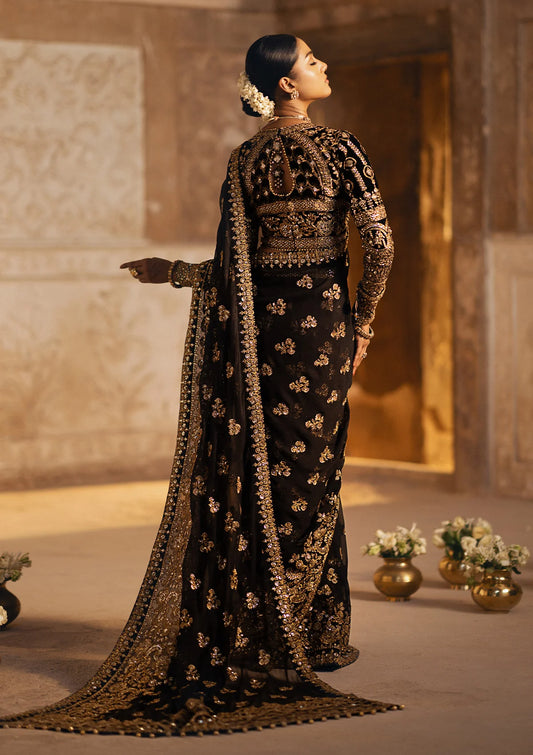 AIK Luxury velvet saree featuring a sculpted embroidered blouse with linear detailing, paired with chiffon saree adorned with floral motifs, organza borders, and jamawaar petticoat.
