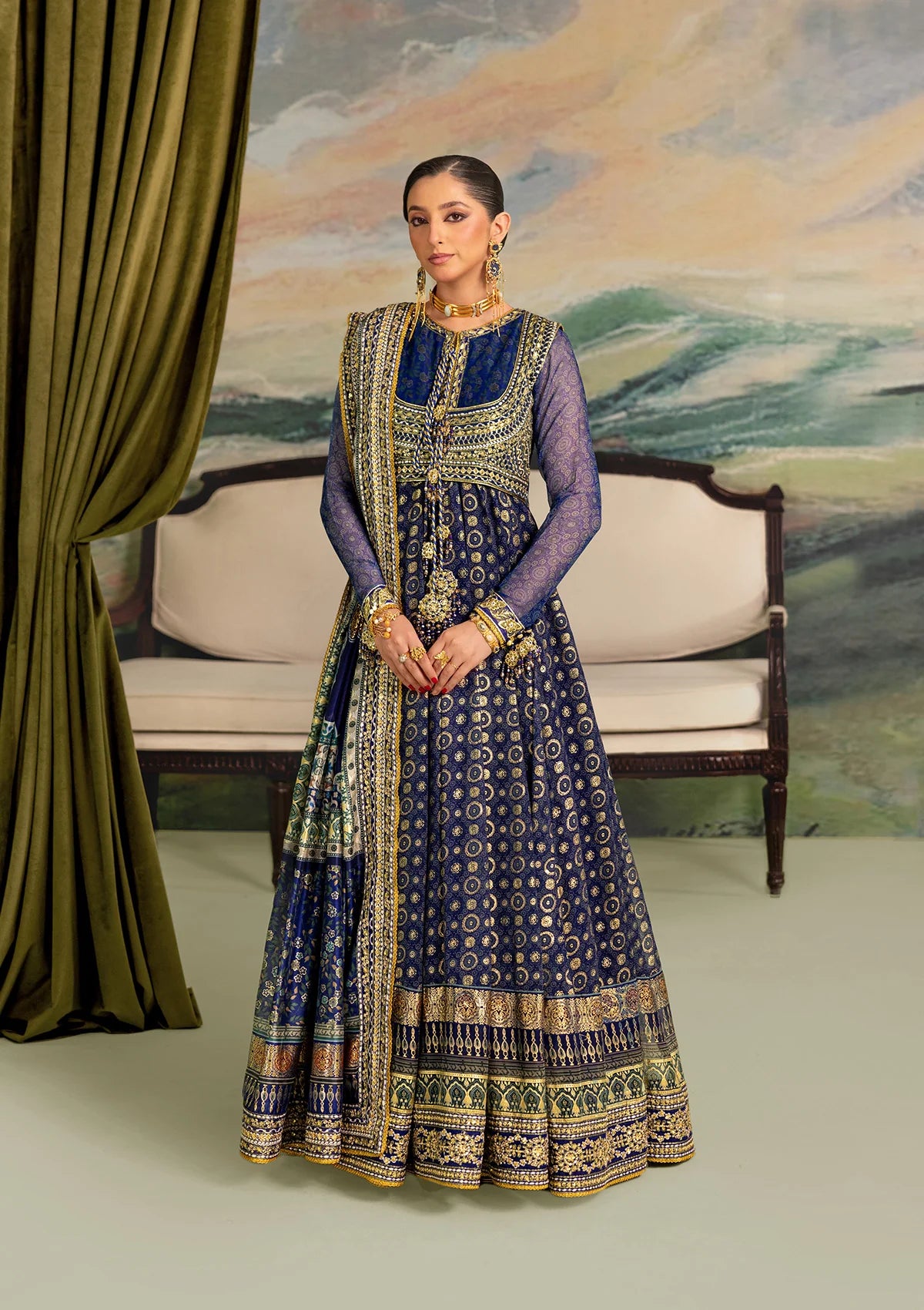 Elegant printed chiffon dress with embroidered silk bodice patches, organza borders and sleeves. Paired with medium silk pants and foil printed silk dupatta.