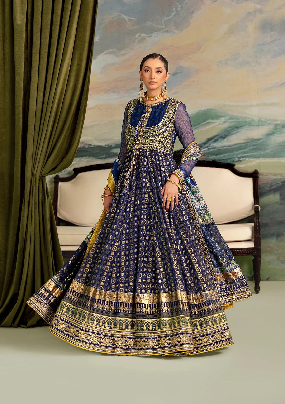 Elegant printed chiffon dress with embroidered silk bodice patches, organza borders and sleeves. Paired with medium silk pants and foil printed silk dupatta.