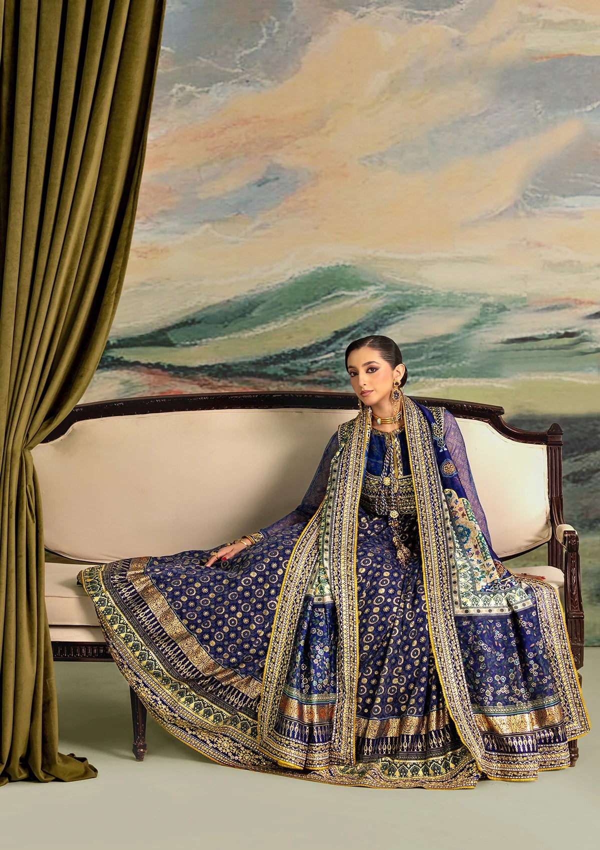 Elegant printed chiffon dress with embroidered silk bodice patches, organza borders and sleeves. Paired with medium silk pants and foil printed silk dupatta.