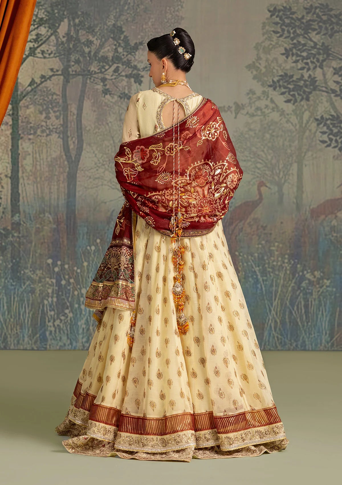 Stylish foil printed chiffon dress with embroidered organza neckline and borders. Paired with printed crepe silk pants and foil printed silk dupatta.