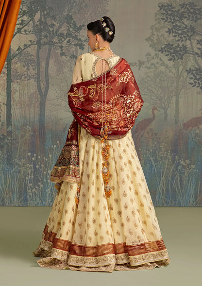 Stylish foil printed chiffon dress with embroidered organza neckline and borders. Paired with printed crepe silk pants and foil printed silk dupatta.