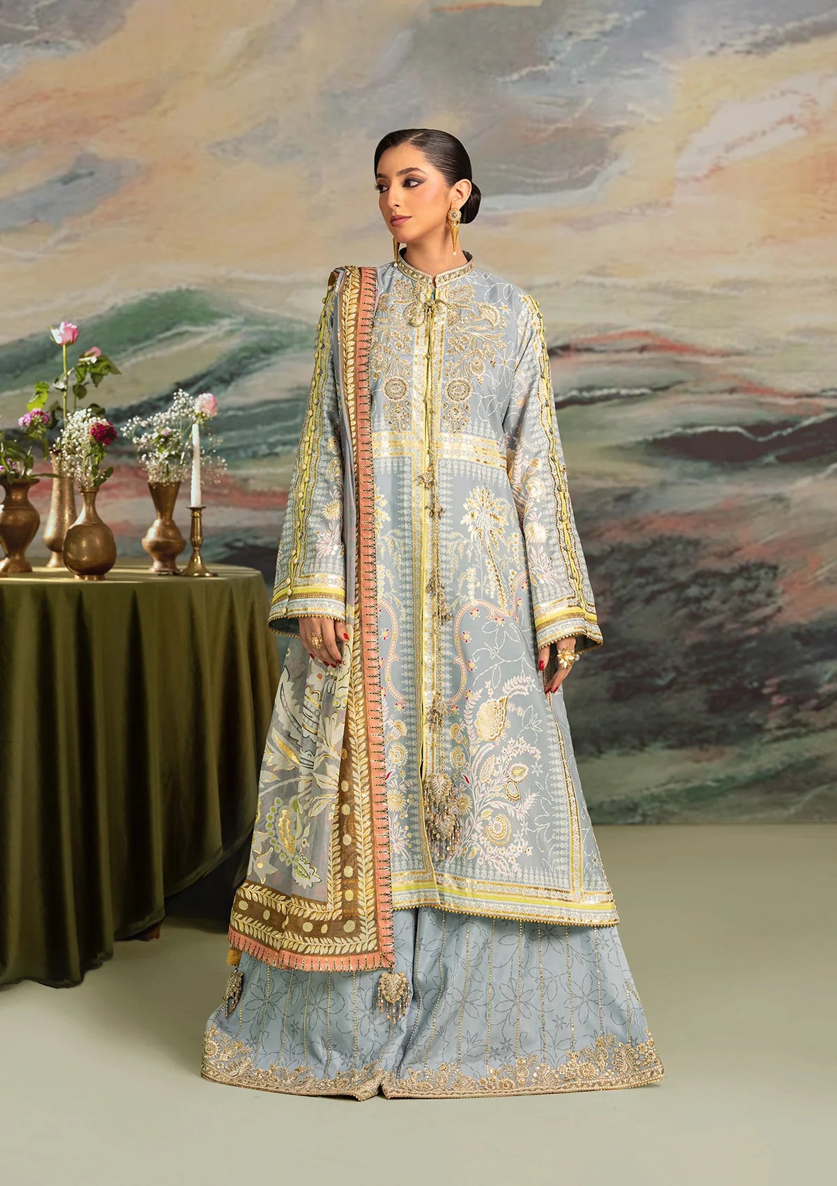 Elegant foil printed crepe silk dress with embroidered organza neckline patch and sleeves. Paired with printed crepe silk pants and foil printed silk dupatta.