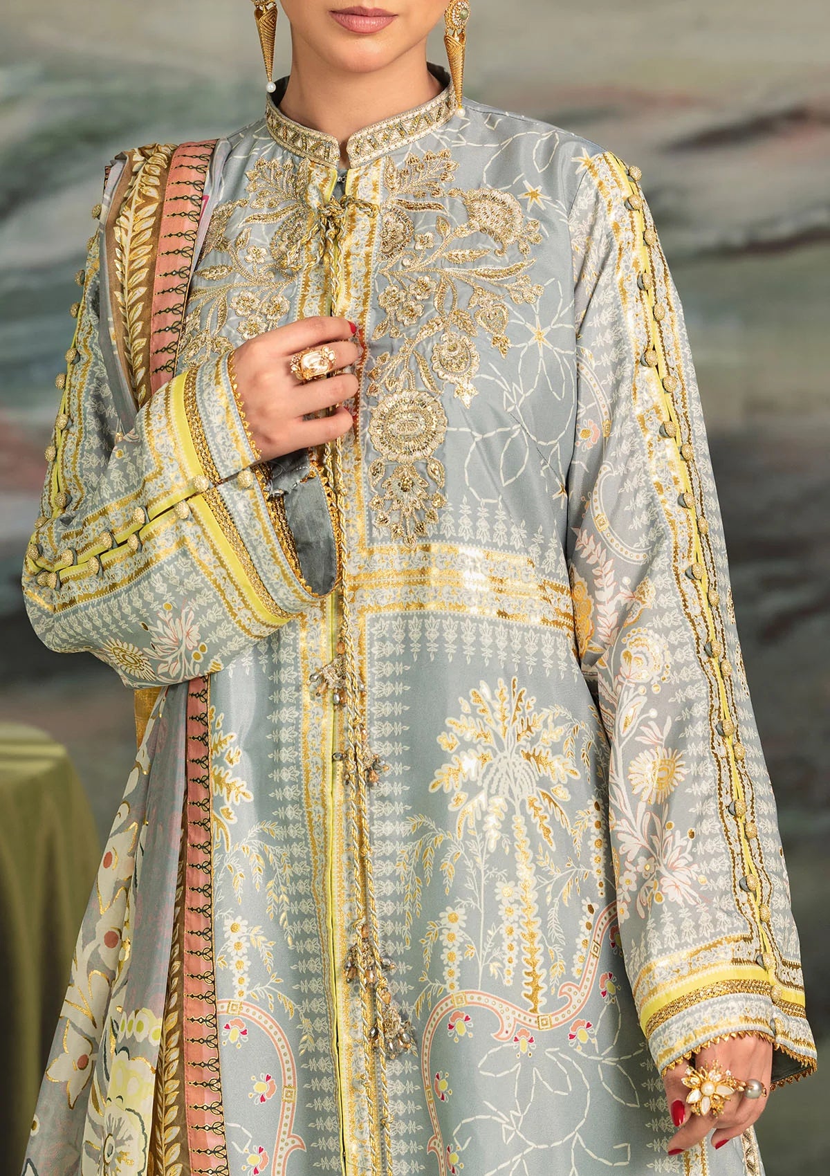 Elegant foil printed crepe silk dress with embroidered organza neckline patch and sleeves. Paired with printed crepe silk pants and foil printed silk dupatta.