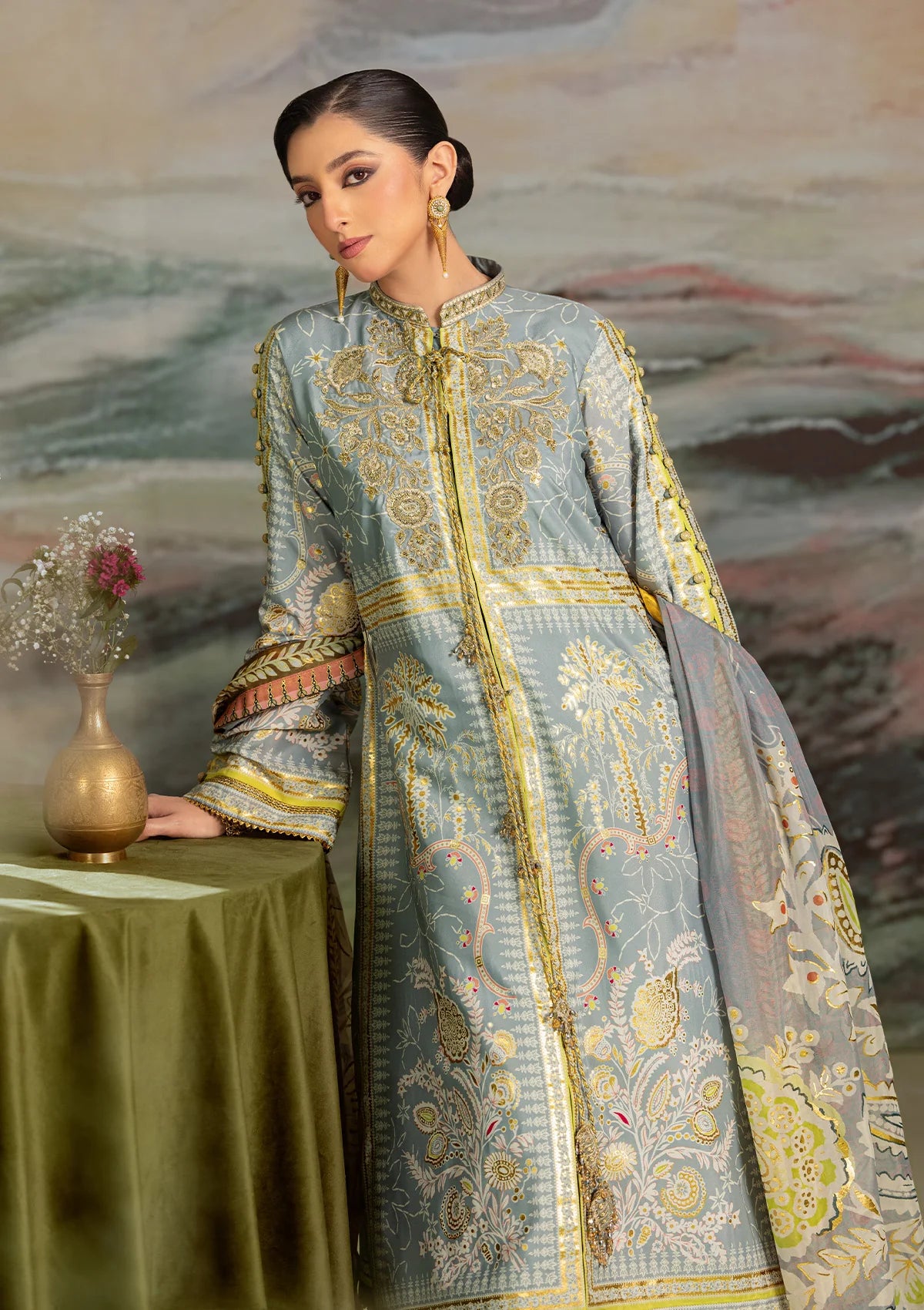 Elegant foil printed crepe silk dress with embroidered organza neckline patch and sleeves. Paired with printed crepe silk pants and foil printed silk dupatta.