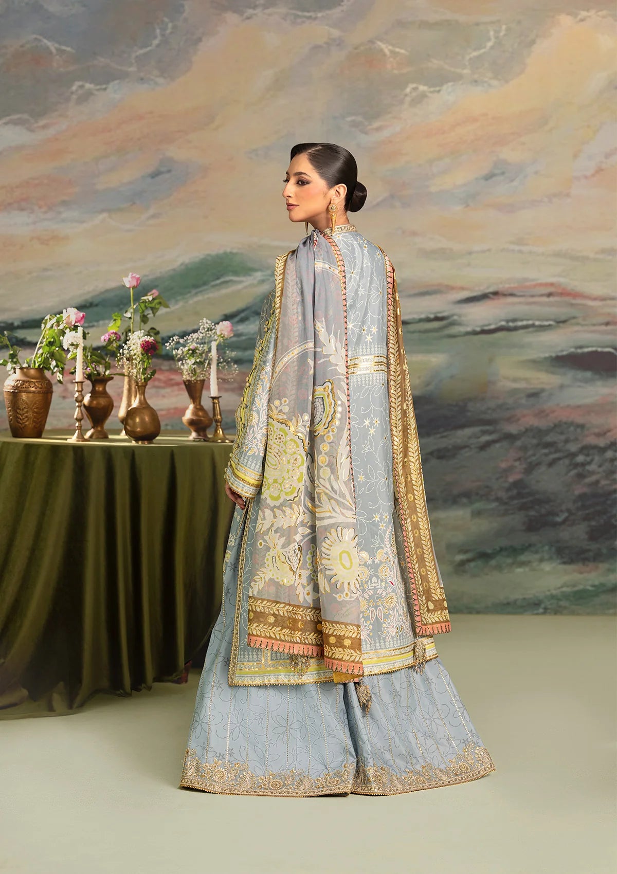 Elegant foil printed crepe silk dress with embroidered organza neckline patch and sleeves. Paired with printed crepe silk pants and foil printed silk dupatta.