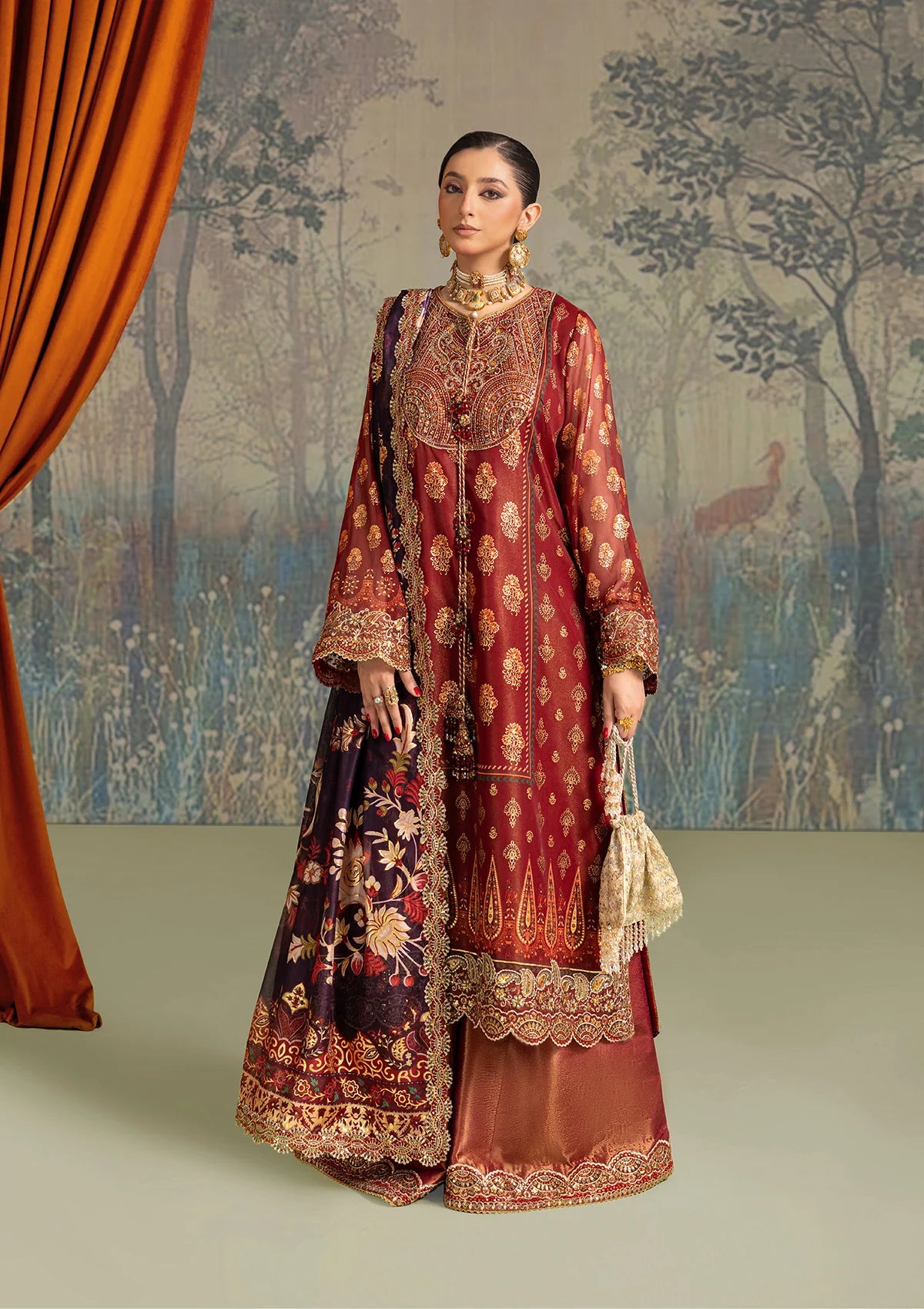 Elegant foil printed chiffon dress with embroidered organza neckline, borders and sleeves. Paired with masoori silk pants and foil printed silk dupatta.