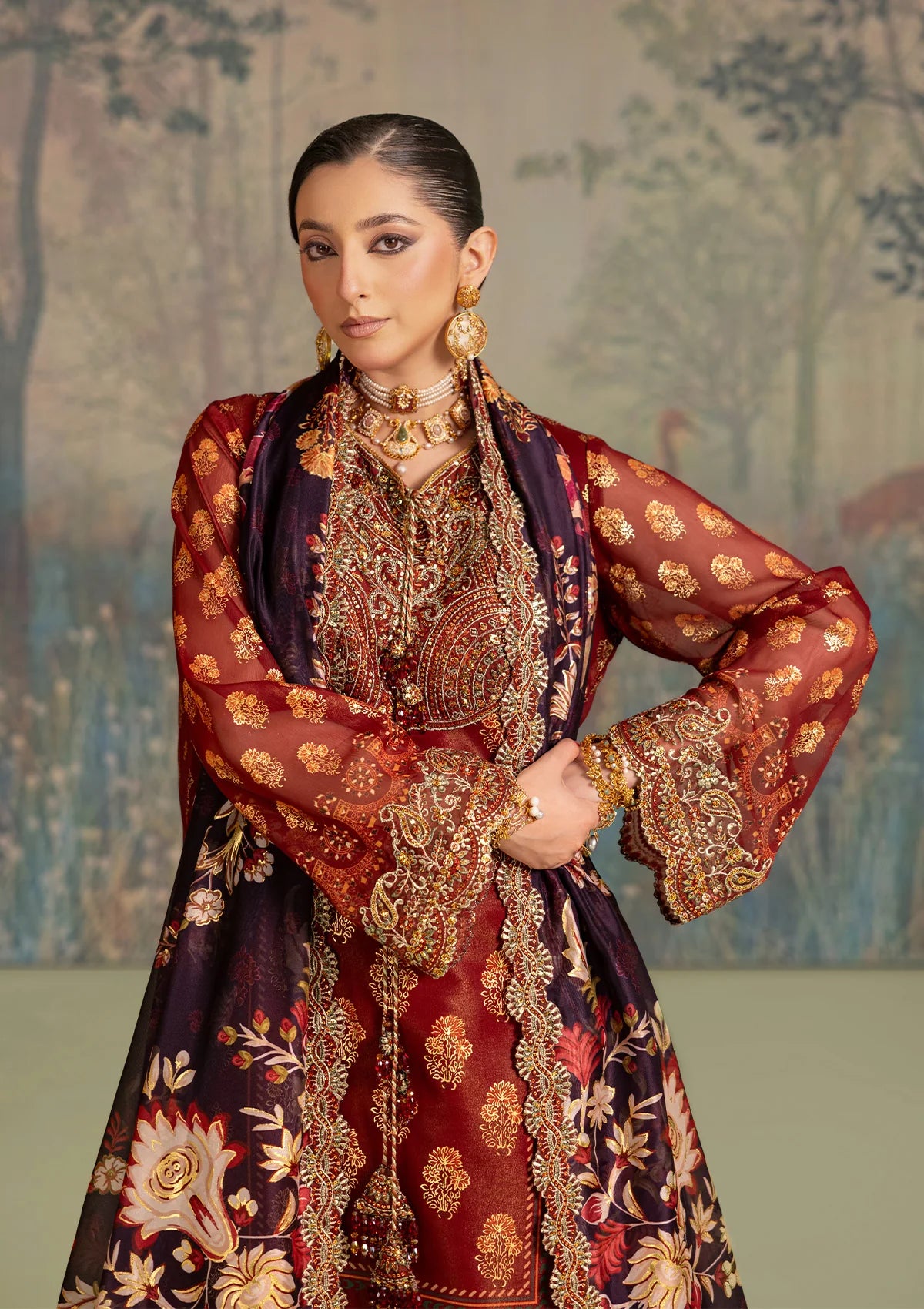 Elegant foil printed chiffon dress with embroidered organza neckline, borders and sleeves. Paired with masoori silk pants and foil printed silk dupatta.