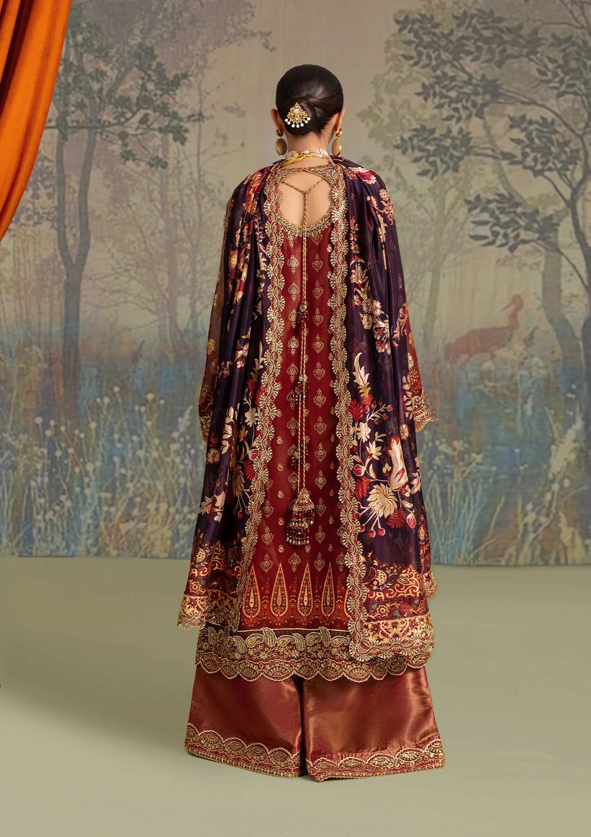 Elegant foil printed chiffon dress with embroidered organza neckline, borders and sleeves. Paired with masoori silk pants and foil printed silk dupatta.