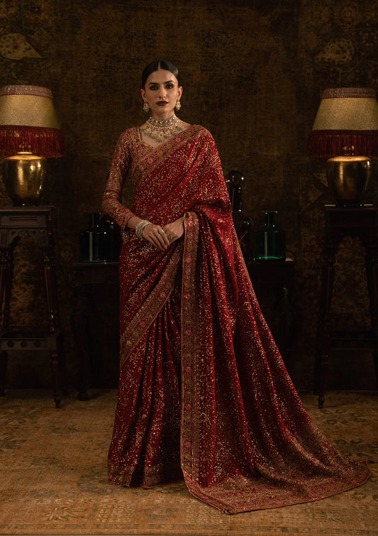 Elegant medium silk saree with embroidered fall, pallu and organza borders, paired with a medium silk blouse featuring embroidered bodice, sleeves and refined detailing.