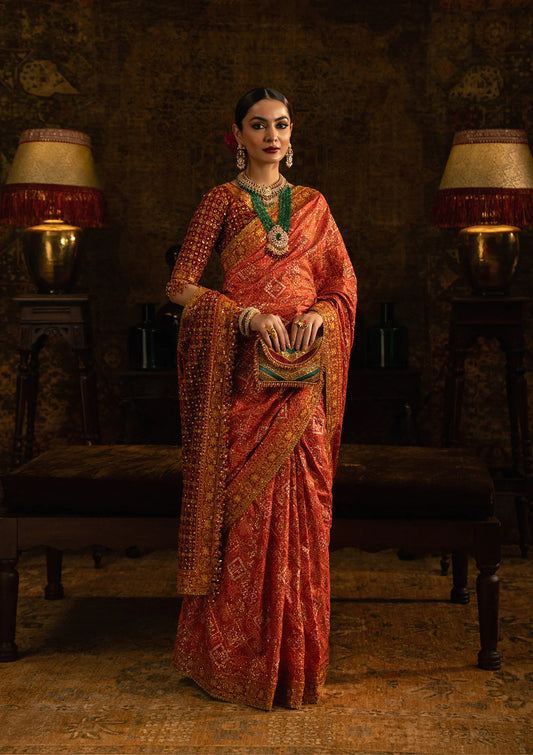 Elegant medium silk blouse with embroidered front, back, and sleeves, paired with printed and embroidered tussar silk saree featuring pallu, borders, and silk petticoat for festive occasions.
