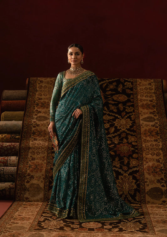 Elegant Jamawar blouse with embroidered bodice, sleeves, and organza neckline, paired with medium silk saree featuring embroidered pallu, borders, and silk petticoat for festive wear.