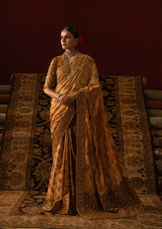 Elegant medium silk blouse with embroidered bodice and sleeves, paired with printed and embroidered tussar silk saree featuring pallu, borders, and medium silk petticoat.