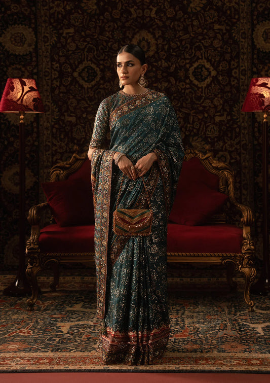 Elegant medium silk blouse with embroidered bodice and sleeves, paired with printed and embroidered tussar silk saree featuring pallu, borders, and medium silk petticoat.