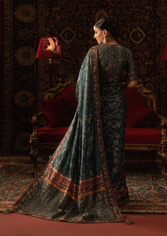 Elegant medium silk blouse with embroidered bodice and sleeves, paired with printed and embroidered tussar silk saree featuring pallu, borders, and medium silk petticoat.