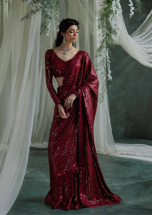 Elegant embroidered chiffon saree with detailed fall and pallu, paired with a chiffon blouse featuring organza neckline, sleeve borders, and silk petticoat.