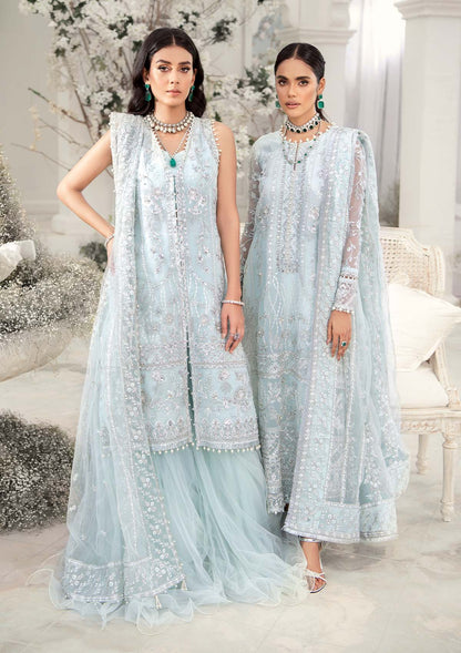 Elegant ice blue organza ensemble featuring hand embellishments, signature embroidery, silver sequins, pearl beadwork, raw silk pants, and an embroidered net dupatta for a refined pastel formal look.